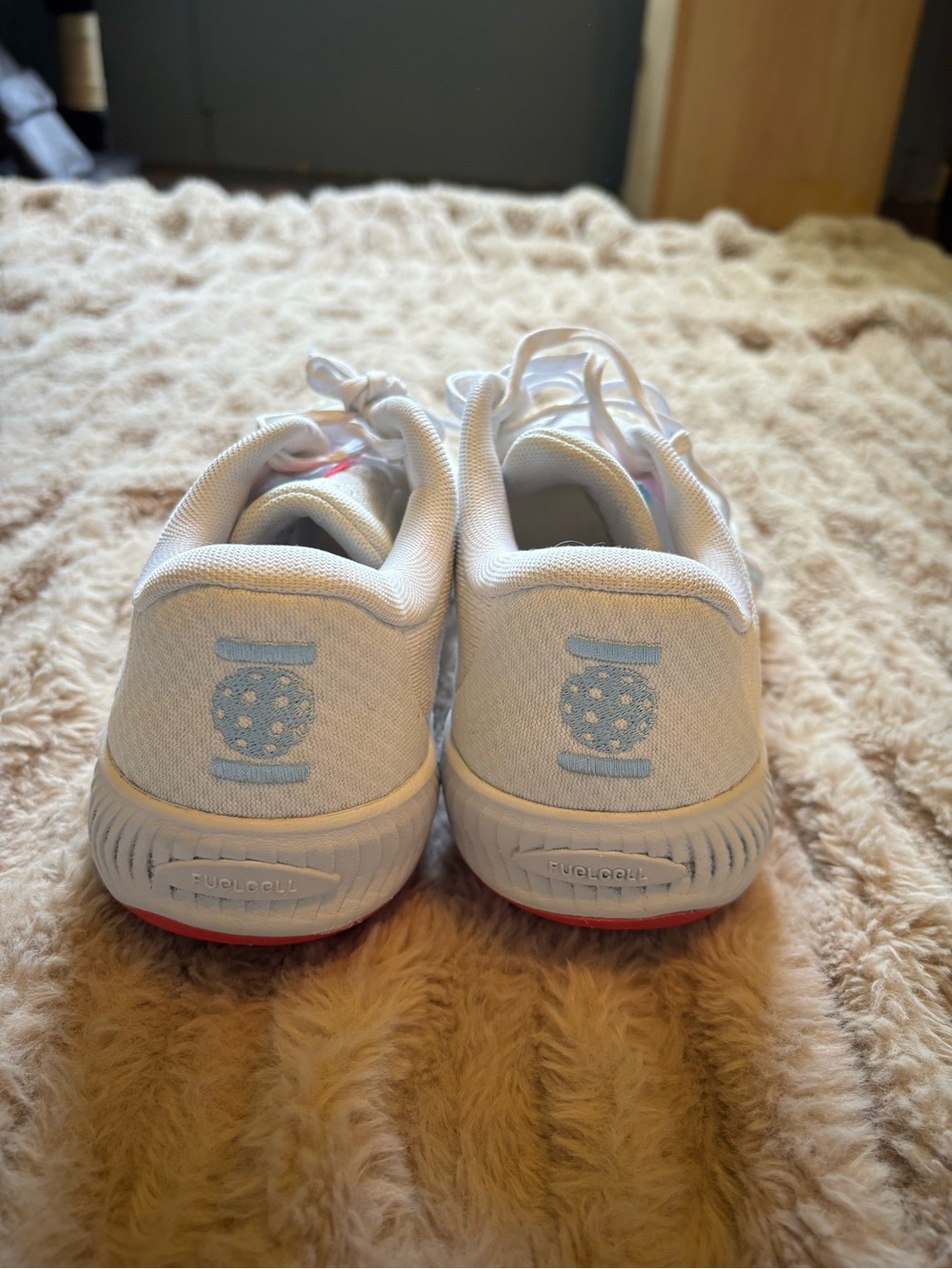 New Balance White Athletic Shoes with Light Blue Accents